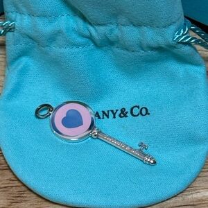 Tiffany & Co Enamel Key pendant charm in pink and Sterling silver.